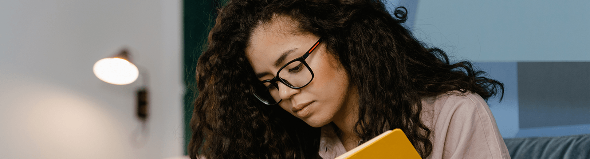 Employee contentedly reading showing signs of good mental health at work