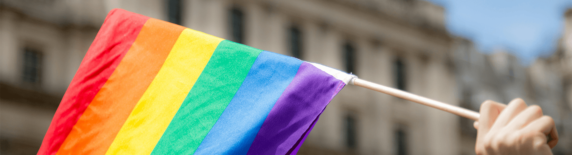 Pride flag being waved for Pride Month